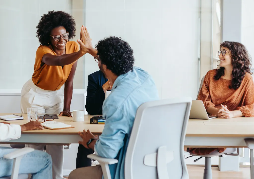 Employees discussing benefits plans in an office setting