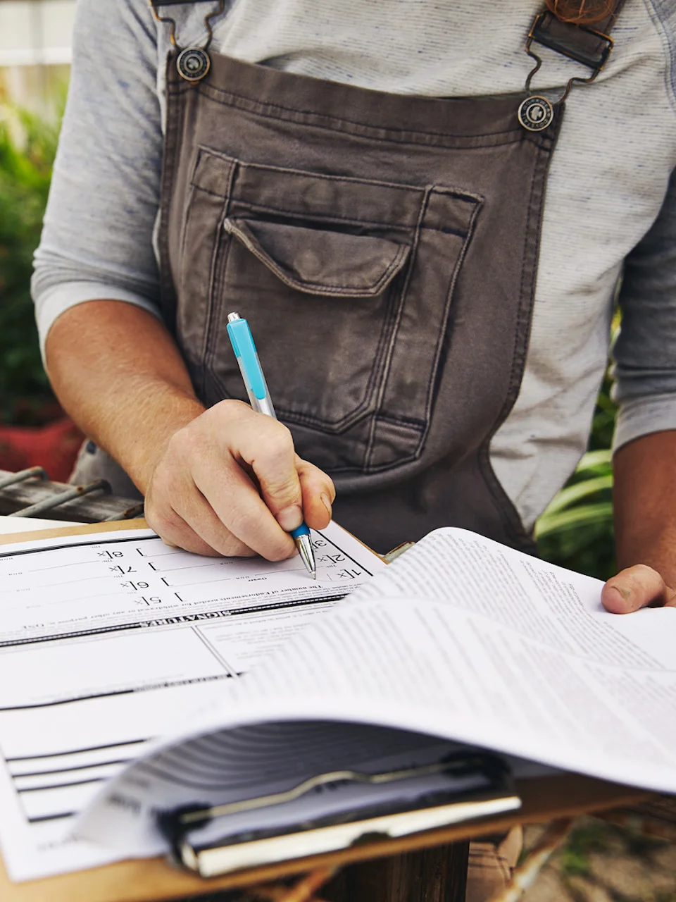 Businesswoman signing loan documents for a business loan