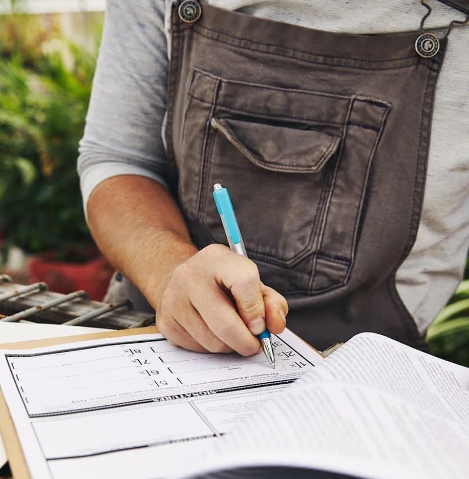 Farmer filling out paperwork