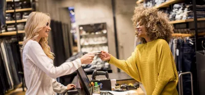 Woman making clothing purchase