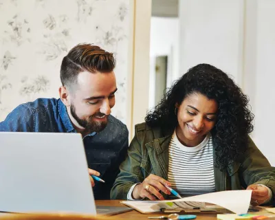 Couple doing paperwork at table