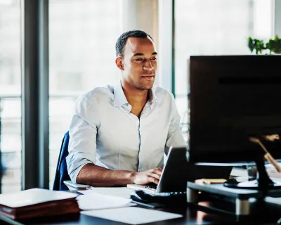 Man working on computer.