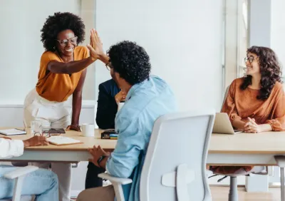 Employees discussing benefits plans in an office setting