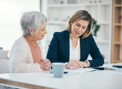 Financial advisor working with lady
