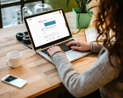 Woman using computer for banking.